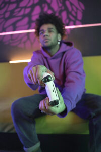 full-shot-young-man-playing-videogame