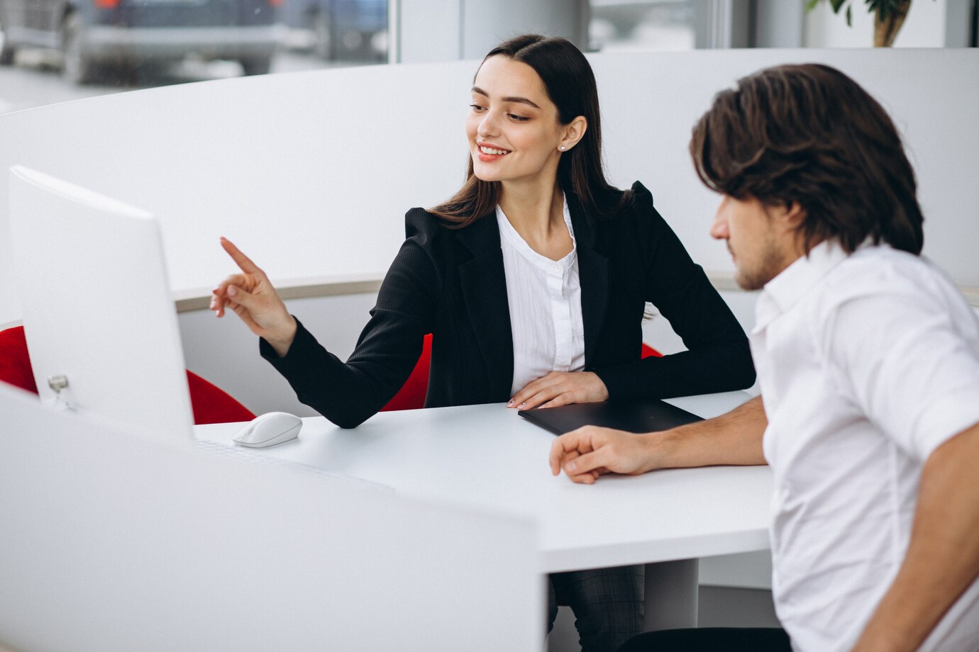 man-talking-with-female-sales-person-car-show-room_1303-17083